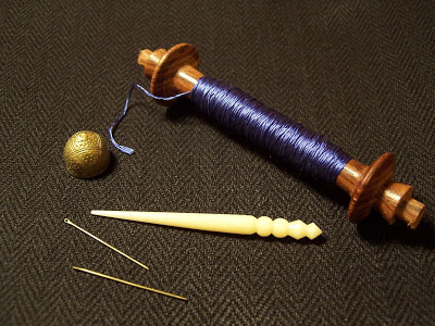sewing brass needles from gaukler bown awl and thread reels from historic enterprises and brass thimble from lorifactor
